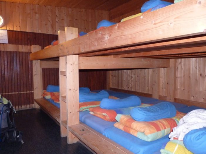 Old style bunks in a mountain refuge.