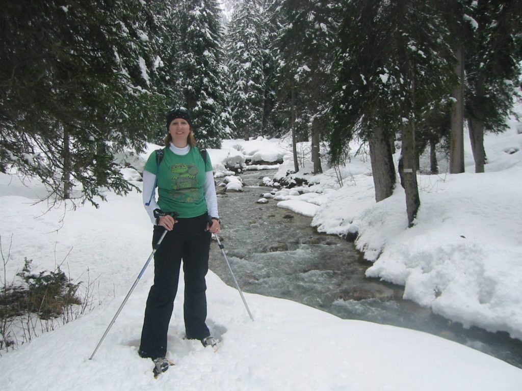 Snowshoeing by a stream at Courchevel
